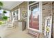 Inviting front porch featuring stone detailing, a welcoming entrance, and a cozy seating area at 1026 Woodglen Dr, Westfield, IN 46074