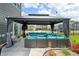 Outdoor gazebo featuring comfortable seating, a television, and privacy curtains providing an inviting entertainment space at 1026 Woodglen Dr, Westfield, IN 46074