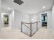 Bright hallway features carpet flooring, wooden railing, and recessed lighting at 1026 Woodglen Dr, Westfield, IN 46074