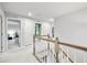 Upper hallway featuring carpet flooring, wooden railing, and neutral walls at 1026 Woodglen Dr, Westfield, IN 46074