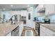 Modern kitchen features stainless steel appliances, granite countertops, a center island, and hardwood flooring at 1026 Woodglen Dr, Westfield, IN 46074
