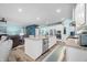 Bright kitchen featuring white cabinets, stainless steel appliances, granite countertops, and an island with bar seating at 1026 Woodglen Dr, Westfield, IN 46074
