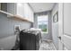 Well-lit laundry room with modern washer and dryer, storage cabinets, and stylish decor at 1026 Woodglen Dr, Westfield, IN 46074