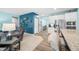 Brightly painted open living area with kitchen and breakfast bar with stainless steel appliances and hardwood floors at 1026 Woodglen Dr, Westfield, IN 46074