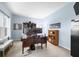 Spacious home office bathed in natural light with ample shelving and a comfortable seating area at 1026 Woodglen Dr, Westfield, IN 46074