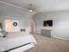 Spacious bedroom with gray walls, ceiling fan, and closet doors that have decorative wreath at 10443 Ringtail Pl, Fishers, IN 46038