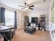 Bedroom featuring a sitting area, neutral decor, and ceiling fan at 10443 Ringtail Pl, Fishers, IN 46038