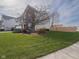 Well-maintained two-story home with a spacious front yard and a mix of brick and siding at 10443 Ringtail Pl, Fishers, IN 46038