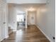 Inviting foyer with hardwood floors, access to an office, and staircase, creating a welcoming entrance at 10443 Ringtail Pl, Fishers, IN 46038