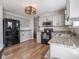 Charming kitchen with gray cabinets, black appliances, and a spacious layout at 10443 Ringtail Pl, Fishers, IN 46038