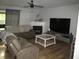 Cozy living room showcasing a fireplace, neutral walls and recessed lighting at 10443 Ringtail Pl, Fishers, IN 46038