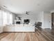 Spacious living room featuring a fireplace, ceiling fan, and ample natural light at 10443 Ringtail Pl, Fishers, IN 46038