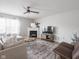 Cozy living room with fireplace, stylish rug, and modern decor at 10443 Ringtail Pl, Fishers, IN 46038