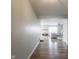 Bright and airy living room with hardwood floors and a view into the living room at 10443 Ringtail Pl, Fishers, IN 46038