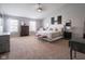 Bright main bedroom with vaulted ceilings, ample windows, and plush carpet at 10443 Ringtail Pl, Fishers, IN 46038