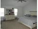 Bright main bedroom with neutral colors, ample natural light, and a comfortable king-size bed at 10443 Ringtail Pl, Fishers, IN 46038
