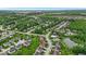 Aerial view of neighborhood, showcasing community amenities like the pool and pond nearby at 10515 Sugar Ridge Way, Indianapolis, IN 46239