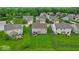 Aerial view of a house showcasing a large backyard, patio set, and surrounding neighborhood at 10515 Sugar Ridge Way, Indianapolis, IN 46239