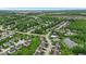 Drone shot of a beautiful community featuring mature trees, a swimming pool, and a pond at 10515 Sugar Ridge Way, Indianapolis, IN 46239