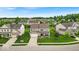 An aerial shot shows a well-kept house and neighborhood with lush greenery at 10515 Sugar Ridge Way, Indianapolis, IN 46239