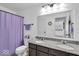 Bathroom featuring a double sink vanity with granite countertops and brushed nickel fixtures at 10515 Sugar Ridge Way, Indianapolis, IN 46239
