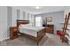 Cozy bedroom with a bed, dresser, and decor, perfect for relaxation at 10515 Sugar Ridge Way, Indianapolis, IN 46239