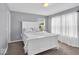 Bedroom featuring a well-lit room with a queen bed, sheer curtains, and neutral wall color at 10515 Sugar Ridge Way, Indianapolis, IN 46239