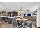 Open concept living space featuring an eat-in dining area that flows into a kitchen and the living room at 10515 Sugar Ridge Way, Indianapolis, IN 46239