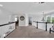 Bright loft space featuring black and white banisters, neutral walls, and an overhead light fixture at 10515 Sugar Ridge Way, Indianapolis, IN 46239