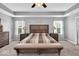 Bright and spacious main bedroom boasts carpeted floors, a ceiling fan and a trey ceiling at 10515 Sugar Ridge Way, Indianapolis, IN 46239
