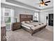 Bright and spacious main bedroom boasts carpeted floors, a ceiling fan and a trey ceiling at 10515 Sugar Ridge Way, Indianapolis, IN 46239