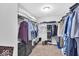 Organized walk-in closet featuring shelving for storage and clothing racks, ideal for maximizing space at 10515 Sugar Ridge Way, Indianapolis, IN 46239