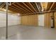 Unfinished basement featuring an open ceiling, sealed walls, painted floor and utility box at 10655 E 200 S, Zionsville, IN 46077