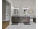Elegant bathroom with dual vanities, marble countertops, and ample storage at 10655 E 200 S, Zionsville, IN 46077