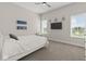 Comfortable bedroom with a ceiling fan, TV, and natural light at 10655 E 200 S, Zionsville, IN 46077