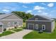 Exterior of the property featuring an attached garage and well-maintained lawn at 10655 E 200 S, Zionsville, IN 46077