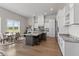 Well-equipped kitchen featuring white cabinets, stone countertops, and an island with seating at 10655 E 200 S, Zionsville, IN 46077