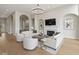 Bright living room with hardwood floors, a fireplace, comfortable seating, and an elegant chandelier at 10655 E 200 S, Zionsville, IN 46077