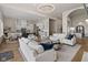 Spacious living room with high ceilings, modern lighting, and stylish furniture at 10655 E 200 S, Zionsville, IN 46077