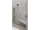 Detailed view of the glass shower with marble surround, including a bench seat at 10655 E 200 S, Zionsville, IN 46077