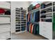 Organized walk-in closet with custom shelving and ample storage for clothes and shoes at 10655 E 200 S, Zionsville, IN 46077
