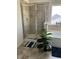 A bathroom with a shower, tub, decorative tiles, and plant, offers a spa-like experience at 10835 Spirit Dr, Ingalls, IN 46048