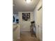 Upstairs hallway featuring a painting of an elephant, a side table and modern décor at 10835 Spirit Dr, Ingalls, IN 46048