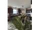 Features a kitchen with stainless steel appliances, an island with chairs, and modern lighting fixtures at 10835 Spirit Dr, Ingalls, IN 46048