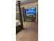 Spacious main bedroom with a media center, television, carpet, and calming neutral tones at 10835 Spirit Dr, Ingalls, IN 46048