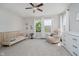 Bright Bedroom featuring a crib, recliner, and ample space for playtime and relaxation at 10962 Stoneleigh Dr, Noblesville, IN 46060
