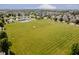 Aerial view of community park with pool, playground, sports field, and walking trails at 10962 Stoneleigh Dr, Noblesville, IN 46060