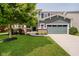 Charming two-story home with a well-maintained lawn and an attached two-car garage at 10962 Stoneleigh Dr, Noblesville, IN 46060