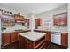 Beautiful kitchen offering wooden cabinets, granite countertops, stainless steel appliances, and a convenient center island at 10962 Stoneleigh Dr, Noblesville, IN 46060