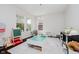 Bright playroom featuring large windows, a play table, and ample space for activities at 10962 Stoneleigh Dr, Noblesville, IN 46060